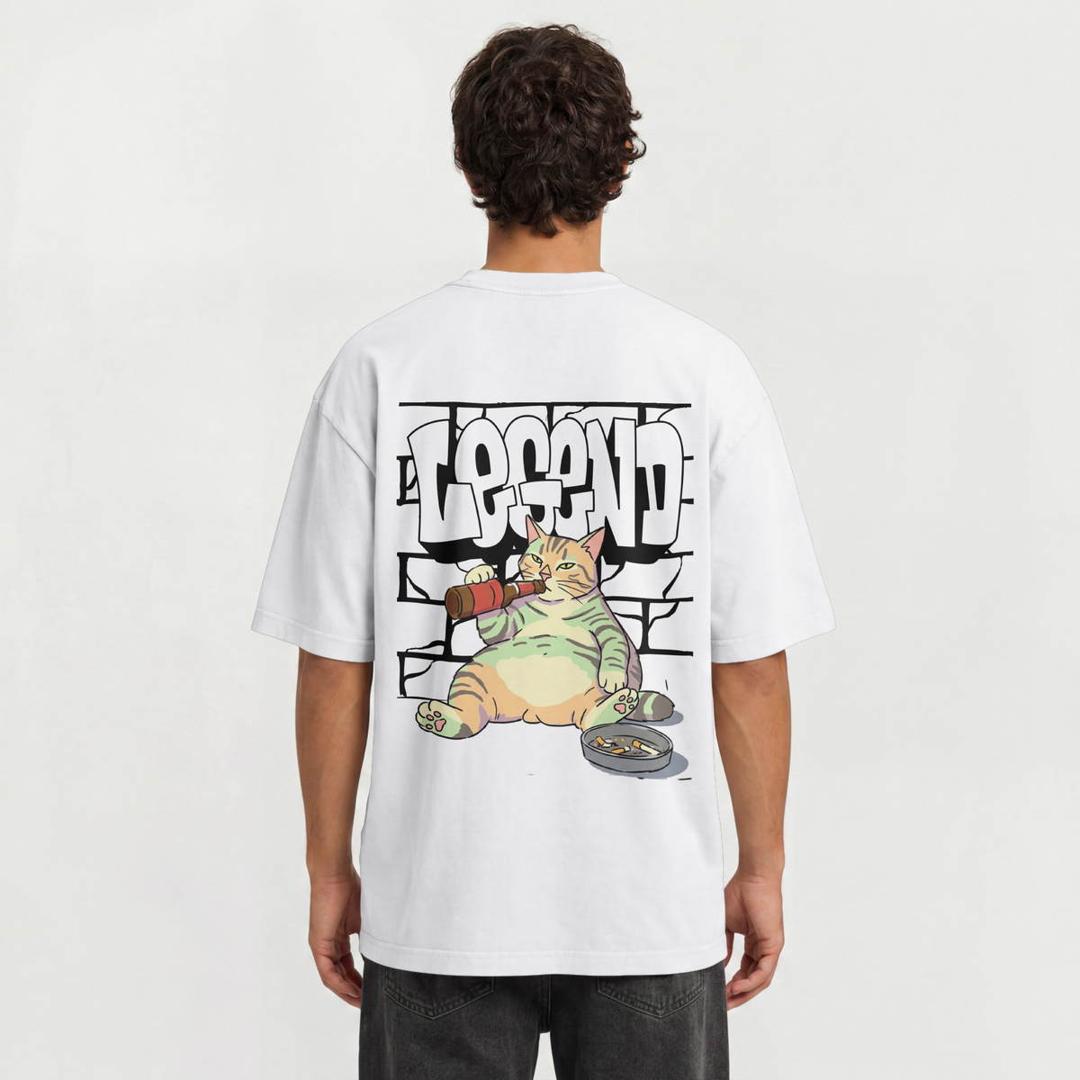 Back view of a graphic t-shirt with a chubby cat drinking beer next to an ashtray with LEGEND graffiti font