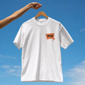 Front view of a premium cotton t-shirt with a small orange HELLO speech bubble badge printed on the left chest