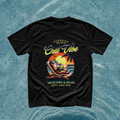 Model showing a black streetwear t-shirt featuring a retro California style vacations and relax cat graphic print