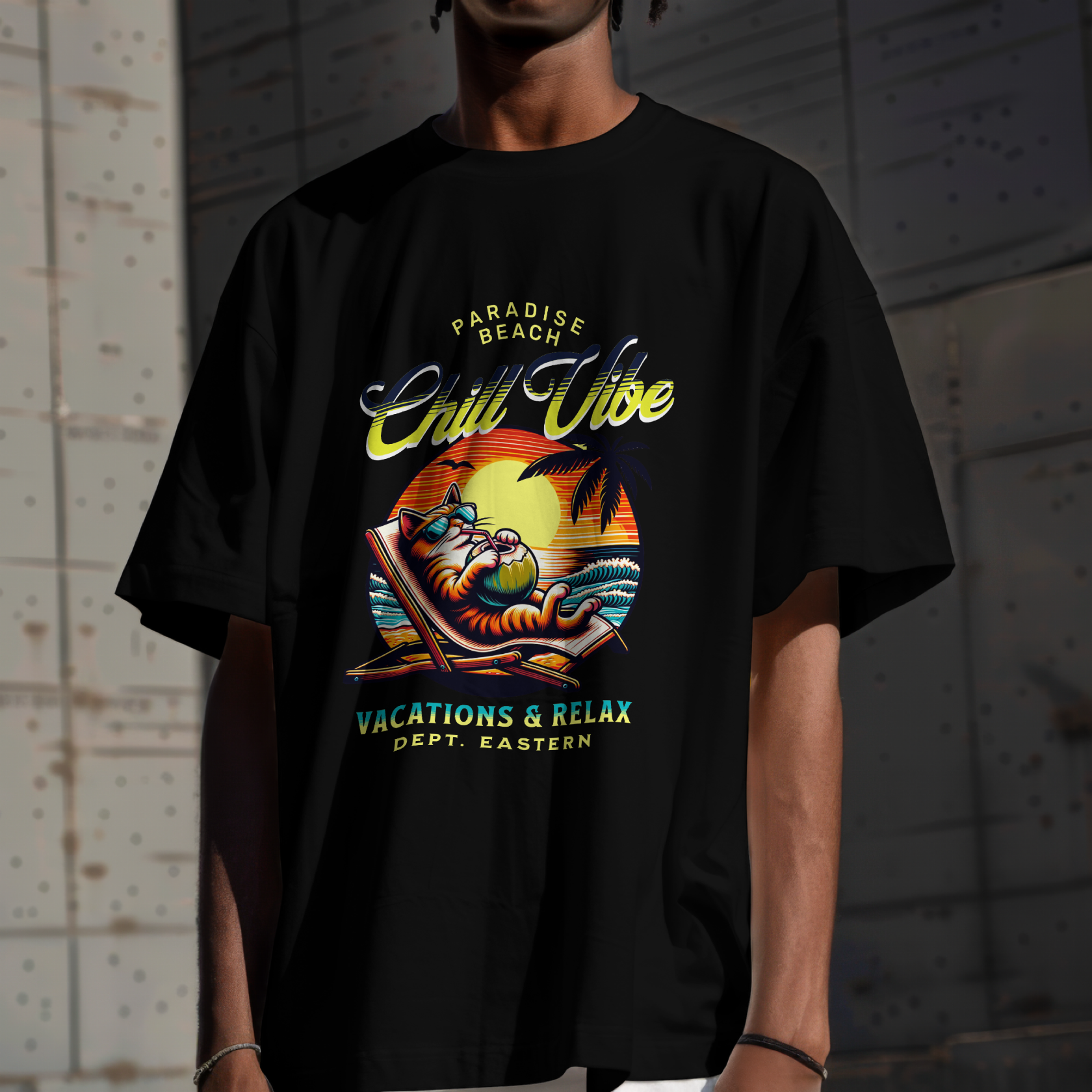 Model showing a black streetwear t-shirt featuring a retro California style vacations and relax cat graphic print
