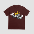Model wearing a maroon premium cotton t-shirt with a bold white Humor King graffiti font and yellow crown graphic