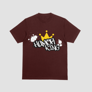 Model wearing a maroon premium cotton t-shirt with a bold white Humor King graffiti font and yellow crown graphic